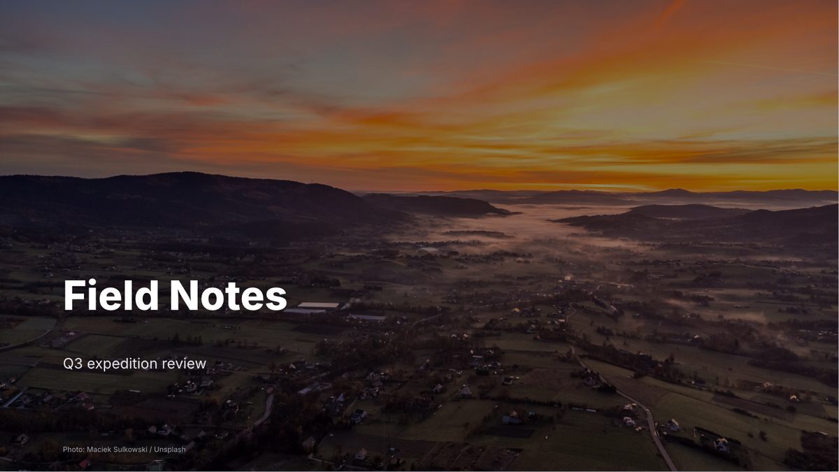 A title slide over an aerial photograph of mountains